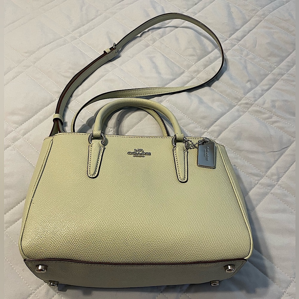 Coach bag, mint green. 10” x 7”. Minor signs of wear (see photos).